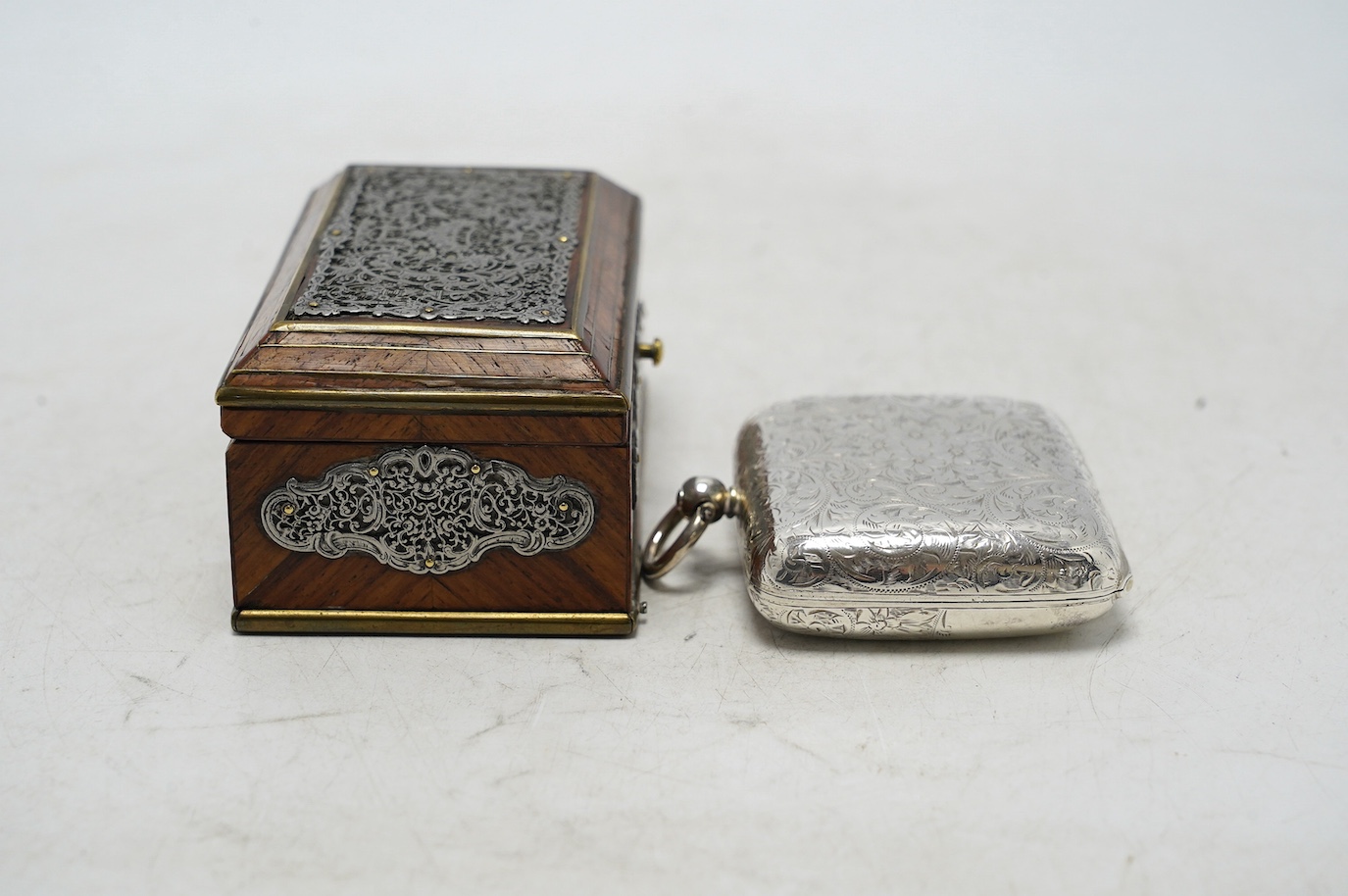 An Edwardian engraved silver combination sovereign/half sovereign and stamp case, E.J. Trevitt & Sons, Chester, 1901, 57mm and a white metal mounted kingwood snuff box. Condition - fair to good